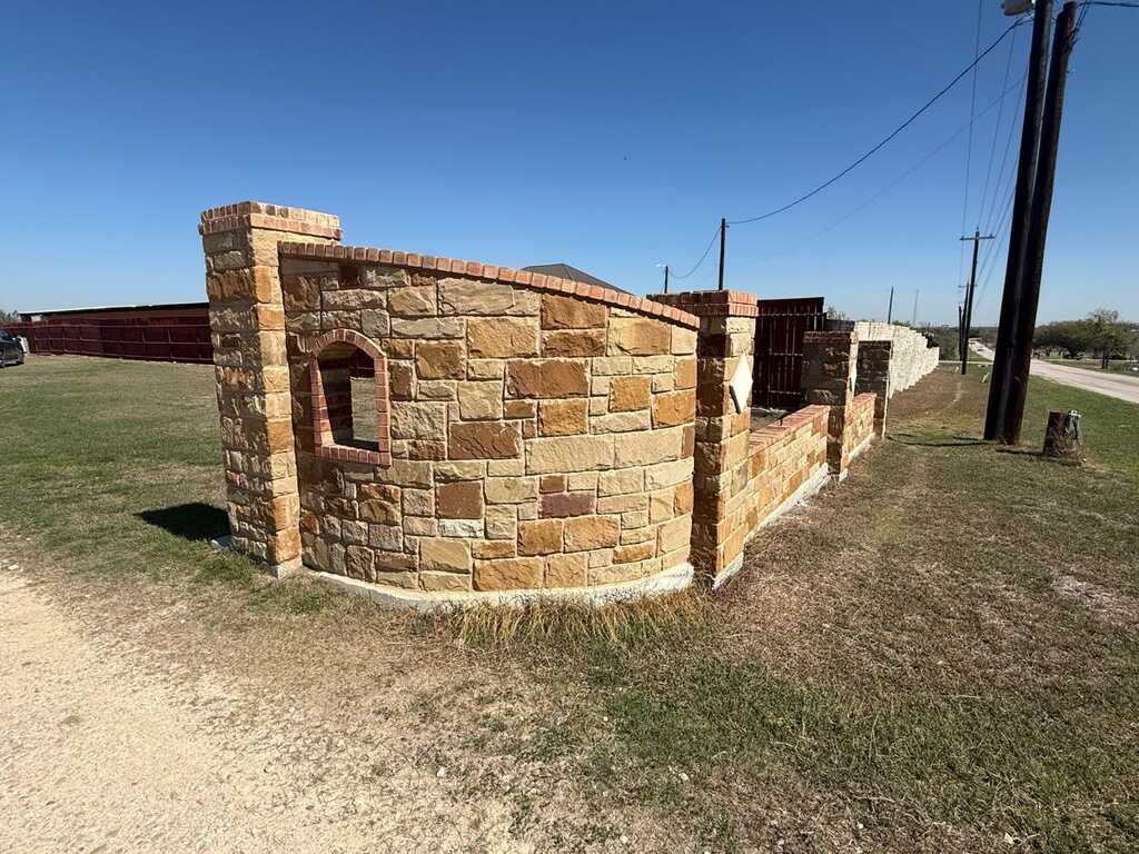 Custom stone masonry perimeter wall - LongHorn Landscape stonework